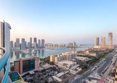 a view of a city with a river and buildings at StayShort - 2 Bedroom in Dubai Marina with Huge Balcony in Dubai