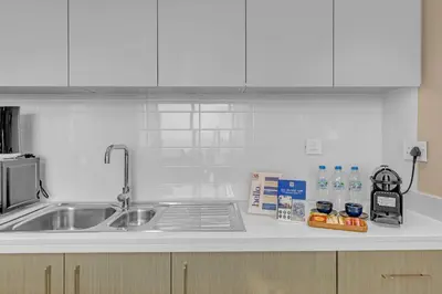 a kitchen counter top with a sink and a counter top at 2BR Luxury Apartment in Downtown Opera in Dubai