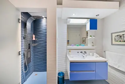 a bathroom with a sink and a shower at Modern Luxury Upgraded 2BR Apartment The Greens in Dubai