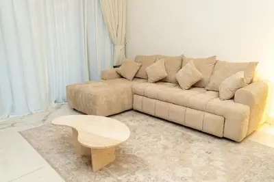 a living room with a couch and a coffee table at 1Luxury Newbedroom nearBusiness Bay in Dubai