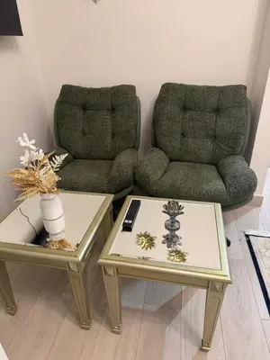 a living room with two tables and a couch at Sophisticated Studio Designer Interiors in Dubai