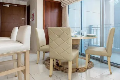 a dining room with a table and chairs at Rustic Retreat in Standpoint, Heart of Downtown in Dubai