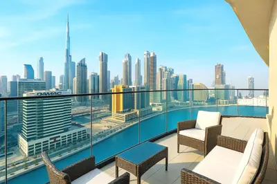 a balcony with chairs and a view of the city at Luxe studio Downtown Burj Khalifa Skyline view in Dubai