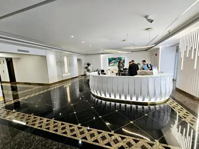 a lobby with a bar in the middle of a building at Beautiful 1-BR next to Barasti Beach in Dubai