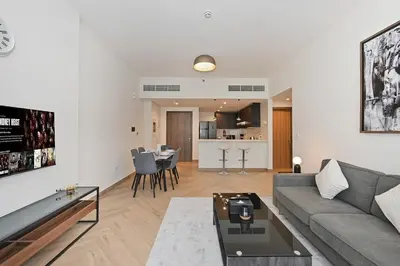 a living room with a couch and a table at Skyline 1 Residence 2204 in Dubai