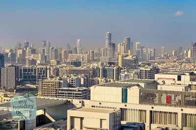a view of a city with a lot of buildings at Luxury-Modern Apt with Theatre-Games-Pool-Gym in Dubai