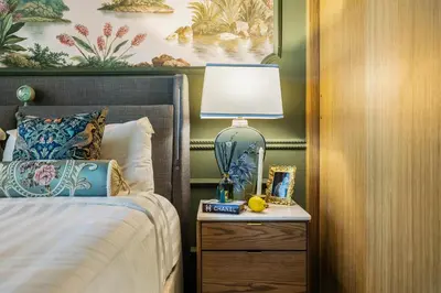 a bedroom with a bed and a lamp on a night stand at BLVD Cozy Stay with Balcony View 10mn to Downtown in Dubai