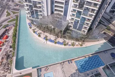 an aerial view of a pool in the middle of a city at Elegant 2BR - Top Amenities - Elite Business Bay in Dubai