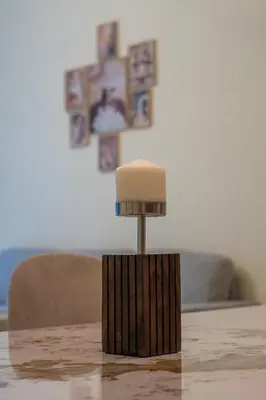 a table with a lamp on top of a table at Nivis find- Bay square -1 BHK in Dubai
