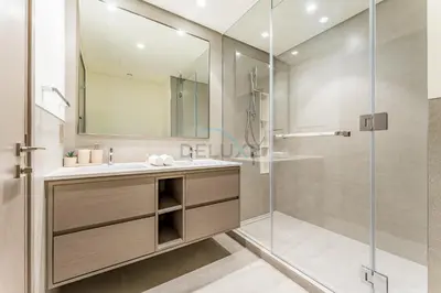 a bathroom with a sink and a shower at High-Floor Luxury 2BR with Full Burj Khalifa & Fountain Views, Seamless Access to Dubai Mall and Burj Park, Grande, Downtown Dubai by Deluxe Holiday Homes in Dubai