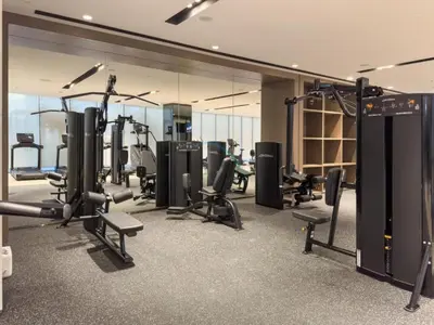 a gym with treadmills and cardio equipment in a building at High-Floor Luxury 2BR with Full Burj Khalifa & Fountain Views, Seamless Access to Dubai Mall and Burj Park, Grande, Downtown Dubai by Deluxe Holiday Homes in Dubai