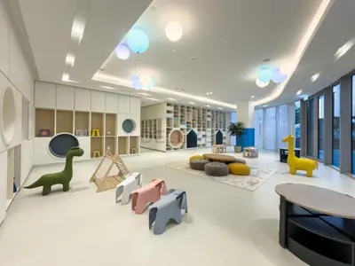 a childrens room with dinosaurs and a play area at High-Floor Luxury 2BR with Full Burj Khalifa & Fountain Views, Seamless Access to Dubai Mall and Burj Park, Grande, Downtown Dubai by Deluxe Holiday Homes in Dubai