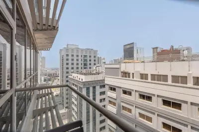 a view of the city from a building at StayShort - Roomy 2BR in Al Barsha with Balcony - Sleeps 4 in Dubai