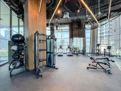 a gym with several treadmills and exercise bikes at Premium 15 Northside Residences in Business Bay, Close to Downtown Dubai & Burj Khalifa by Stayfinity in Dubai