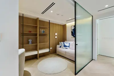 a living room with a couch and a table at Luxurious 2BR Breathtaking Huge Pool & Sea Views in Dubai