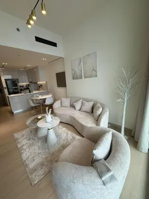 a living room with two couches and a table at Luxury 1BR Apartment In Binghatti Corner, High Floor In JVC in Dubai