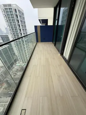 a glass floor in a building with a view of a city at Luxury 1BR Apartment In Binghatti Corner, High Floor In JVC in Dubai