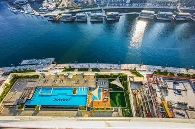 an aerial view of a building next to the water at 3 Bedroom unit at DAMAC maison Canal Views in Dubai