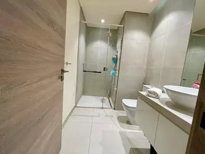 a bathroom with a toilet and a sink and a shower at Luxury Apartment Marina in Dubai