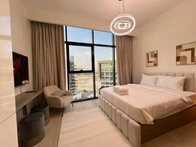 a bedroom with a bed and a large window at Urban SkyView Apartment Near Downtown Dubai in Dubai