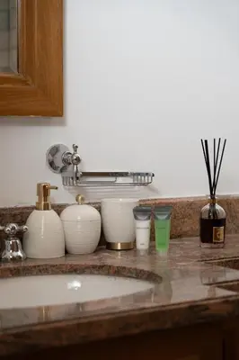 a counter top with bowls and glasses on it at 5 Minutes Dubai Mall - Burj Khalifa - View pools in Dubai