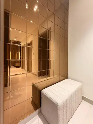 a walk in closet with a glass wall at The Royale Mocha Jacuzzi Suite 34-10 I JVC I Dar Oasis in Dubai