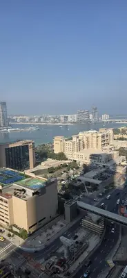 an aerial view of a city with buildings and roads at Elite Residence, Marina in Dubai