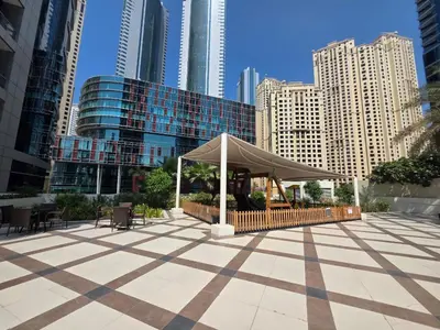 a pavilion in the middle of a city with tall buildings at Spacious 1BHK Apt with Canal View in Dubai Marina in Dubai