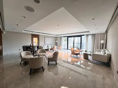 a living room with couches and a piano at Act Tower 410 in Dubai