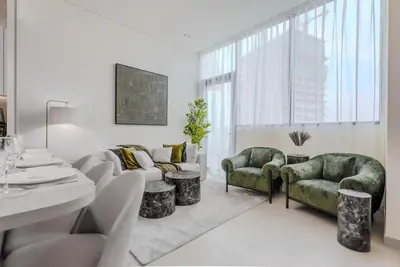 a living room with a couch and two chairs at TRPS - Binghatti Royale, JVC - Private Pool, Luxury Furnished, Brand New in Dubai