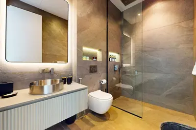 a bathroom with a toilet and a sink and a shower at Vacationer l Magnificent 4 Bedroom l Penthouse l Marina Views in Dubai