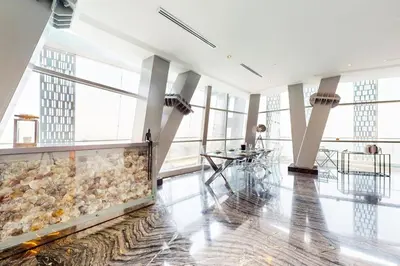 a large room with a large aquarium in the middle at Vacationer l Magnificent 4 Bedroom l Penthouse l Marina Views in Dubai