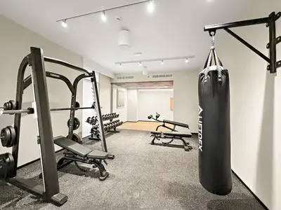 a gym with a punching bag hanging on the wall at FIRST CLASS 1BR Creek Escape & Modern Elegance in Dubai
