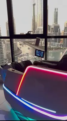 a room with a view of a city from a building at Futuristic luxury apartment, 360 lake view balcony in Dubai