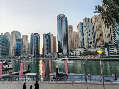 a city with tall buildings next to a body of water at 1 Bedroom in Dubai Marina Walk, Partial Water View in Dubai