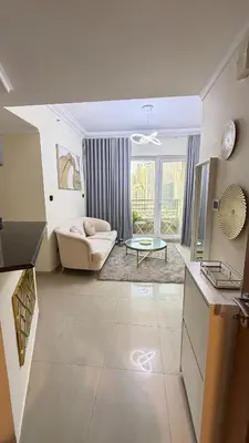 a living room with a couch and a table at Luxury 1BR Apt with water canal & Marina View in Dubai