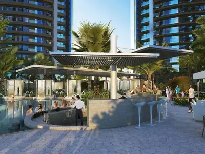 a man standing next to a pool in a resort at Newly Furnished Luxury 1BHK at Paramount Tower D in Dubai