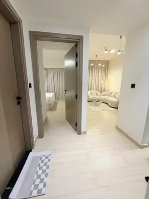 a room with a hallway with a checkerboard floor at Luxury Binghatti Crest 1BR Apartment with Pool & Balconies in Dubai