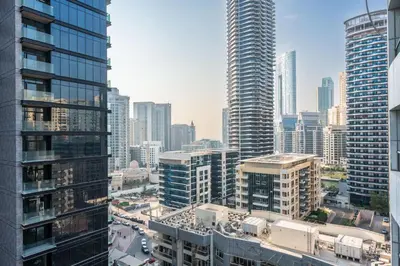 an aerial view of a city with tall buildings at StayShort - 1 Bed Apartment Sleeps 4 in Dubai Marina in Dubai