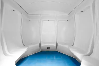 a small room with blue flooring in a white boat at StayShort - 1 Bed Apartment Sleeps 4 in Dubai Marina in Dubai