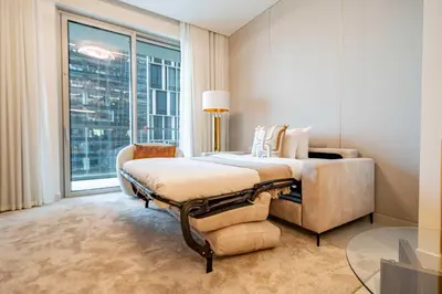 a bedroom with a bed and a large window at Frank Porter - Vida Residences Dubai Mall in Dubai