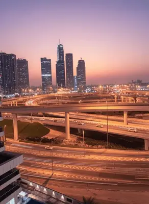 a view of a city at night with traffic at Luxury studio in Dubai Marina in Dubai