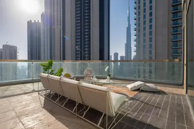 a balcony with a table and chairs on a building at Test Property - NoBookings in Dubai