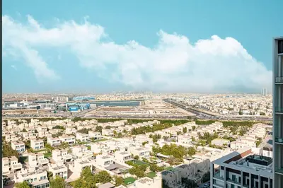 an aerial view of a city with buildings at Restay Homes at Binghatti Azure - Great City Escape - Swimming Pool Access in Dubai