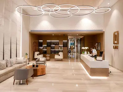 a lobby of a store with a chandelier at Full Dubai Marina View 2BR Apartment in Dubai