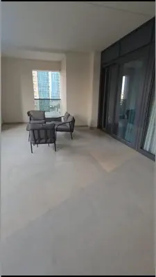 a living room with two chairs and a table at 2BR next to Dubai mall with Khalifa Tower view! in Dubai