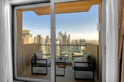 a balcony with a view of the city at Waves - Modern Comfort 1BR Apt at JW Marriott Marina Mall in Dubai