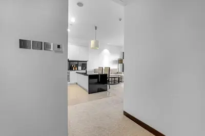 a kitchen and living room with white walls at Waves - Modern Comfort 1BR Apt at JW Marriott Marina Mall in Dubai