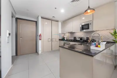 a kitchen with a sink and a counter top at Easy access to Community Parks and Green Spaces,15 minutes drive to Miracle Garden - Rigel, JVC, by Deluxe Holiday Homes in Dubai
