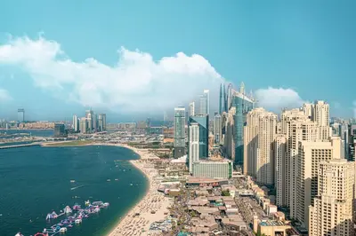 a view of a city with a beach and buildings at Sky Palace 3 Bedroom Penthouse on JBR in Dubai